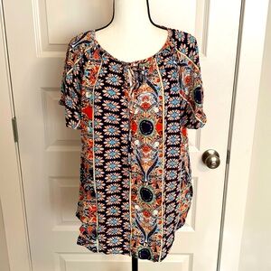 Angashion| Navy/burnt orange print short sleeve scoop neck top with tie accent.